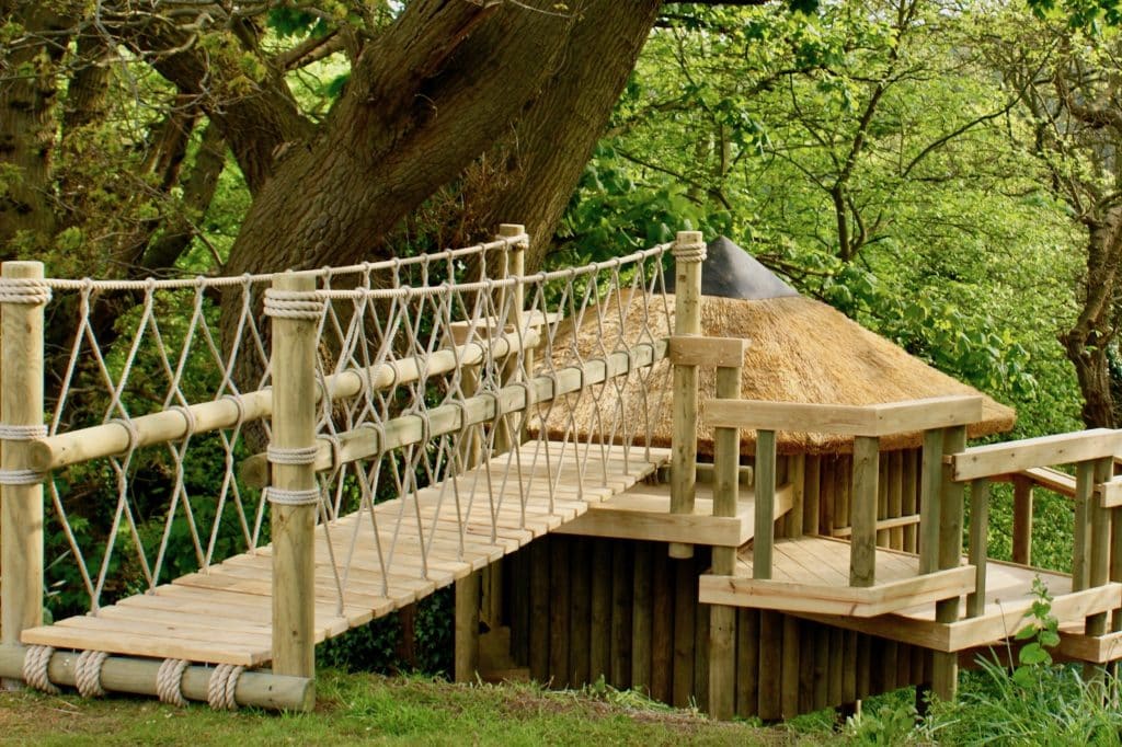 Rope Bridge leading from garden to a Treehouse and multi-level Decks and Platforms